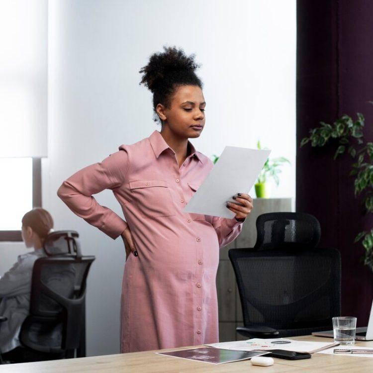 medium-shot-pregnant-woman-holding-paper_23-2149304071.jpg